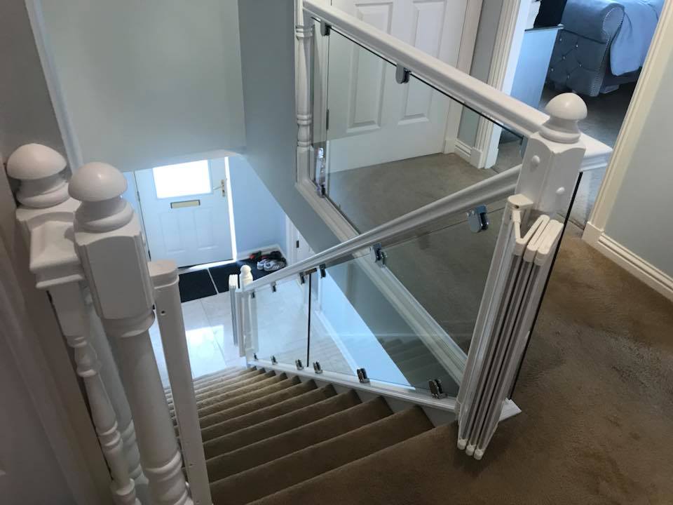 Glass banister finished in Rosyth. We kept the existing handrail and newel posts but cut the old spindles out and removed the old base rail. A new base rail was fitted to house the clamps.
