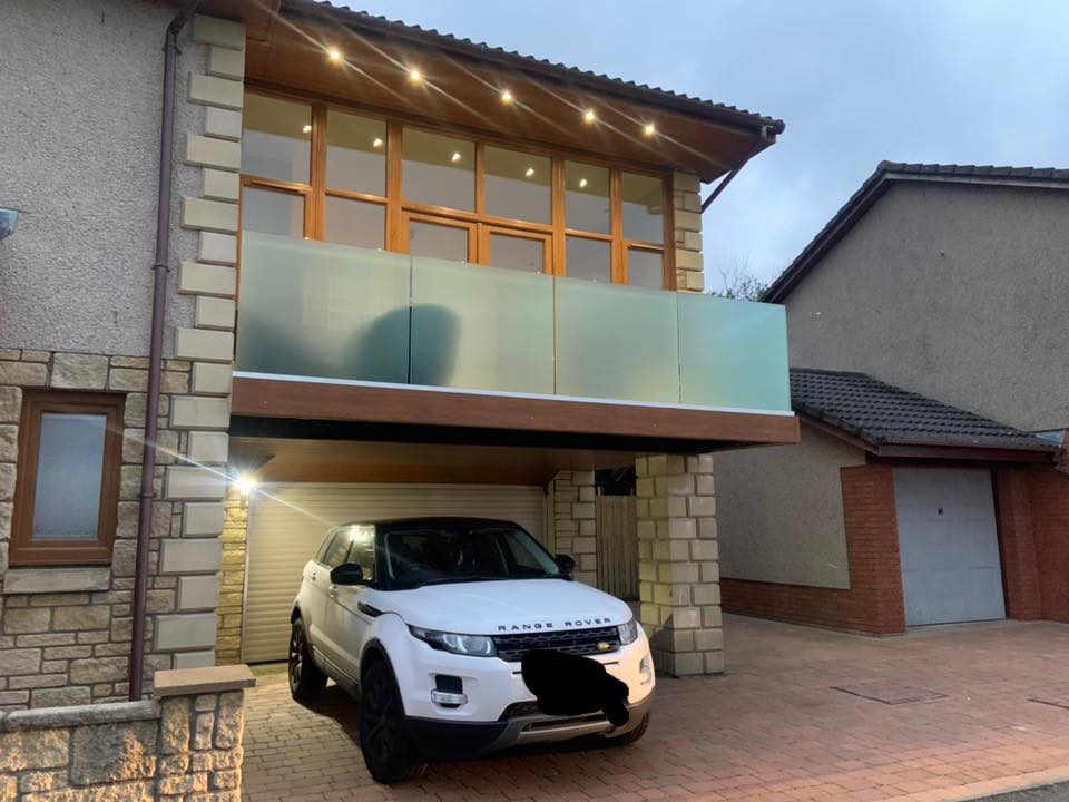  
                        Satin toughened frameless balustrade and Juliet balcony fitted to a house in Cowdenbeath.