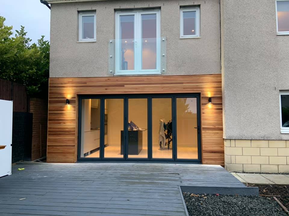 Here we removed the existing windows and patio door and cut out for 3.9m anthracite grey bifolds to open out in to the garden. K9 lintel fitted externally and steel internally