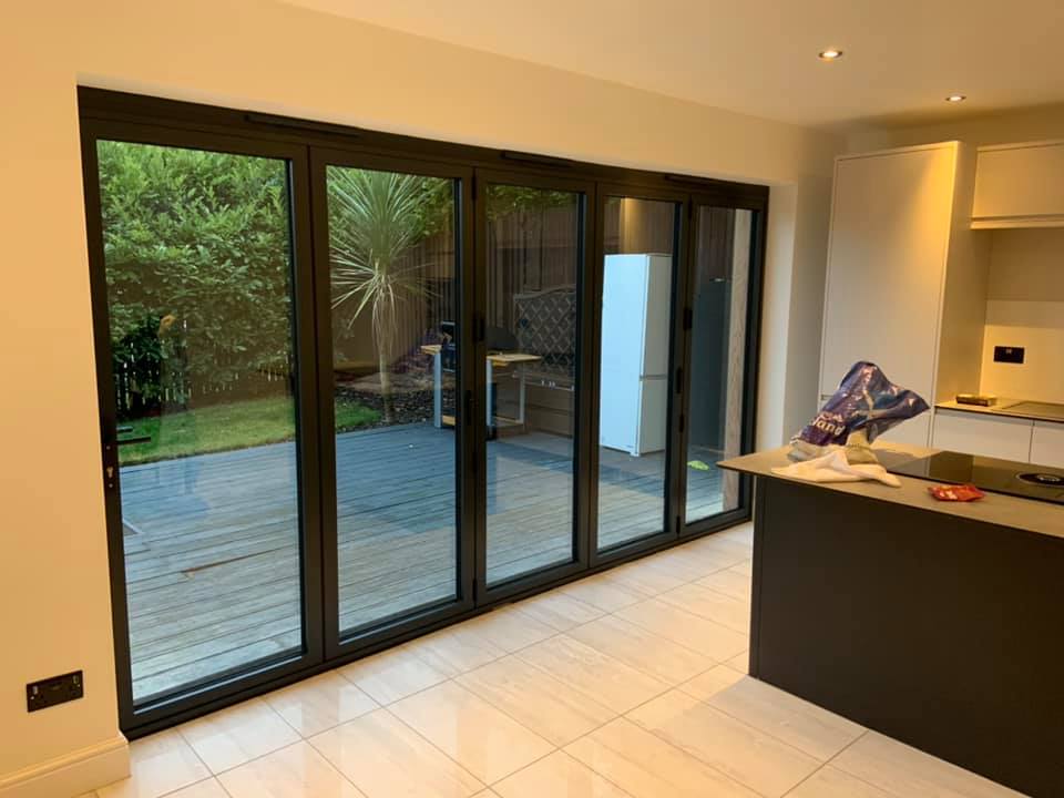 Here we removed the existing windows and patio door and cut out for 3.9m anthracite grey bifolds to open out in to the garden. K9 lintel fitted externally and steel internally