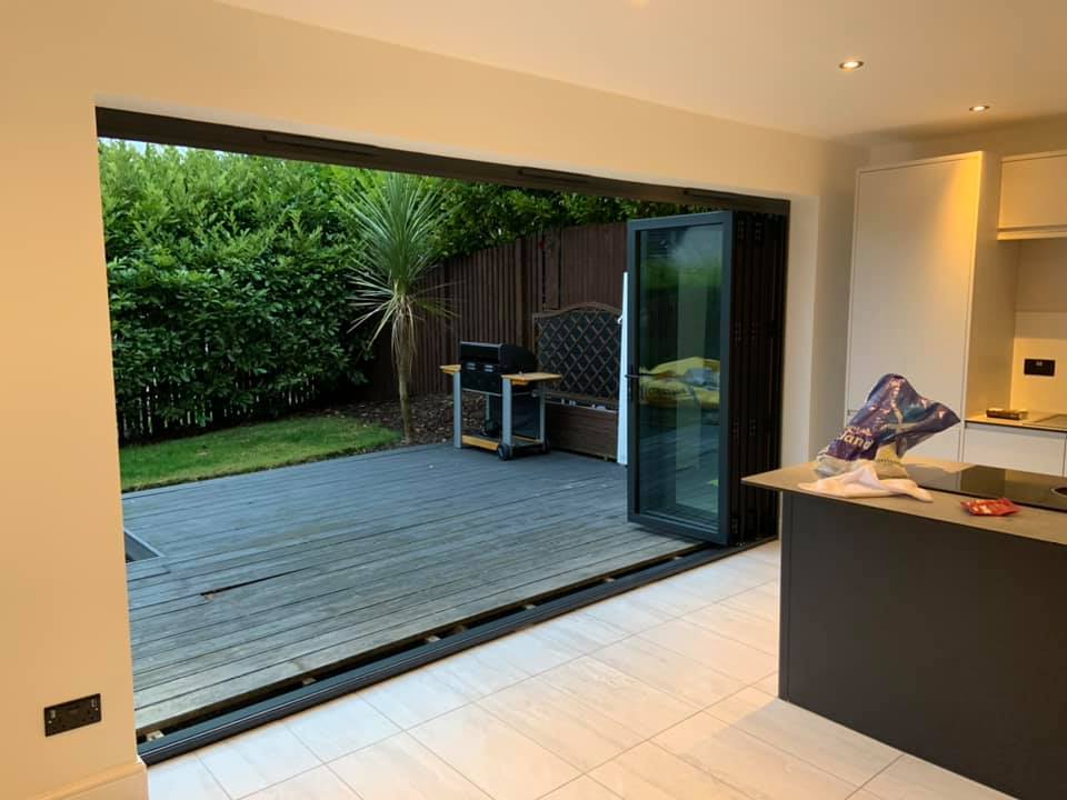 Here we removed the existing windows and patio door and cut out for 3.9m anthracite grey bifolds to open out in to the garden. K9 lintel fitted externally and steel internally